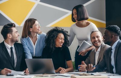 Happy young business team planning strategy while working at the modern office together